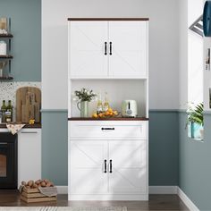 a kitchen with blue walls, white cabinets and an oven in the middle is shown