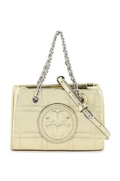 Tory Burch Mini Fleming Sac en cuir laminé avec des pilecks en diamant et des poignées de chaîne à double T. surdimensionnées avec cuir tissé, fermeture magnétique. Intérieur de tissu avec une fente de carte et un bandoulière réglable et détachable. Varement métallique fini en or. Leather Chain, Leather Care, Diamond Pattern, Magnetic Closure, Tote Handbags, Bag Making, Mini Bag, Accessories Design, Luxury Bags