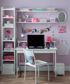 a white desk with a computer on top of it