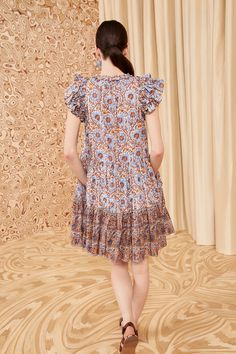 Our Coletta Dress is cut from our airy shadow stripe fabrication that’s awash in soft blue, orange, and red botanicals inspired by a 19th century Persian print. This mini dress features a flowy, A-line silhouette framed by flutter sleeves, side pockets, and delicate neckties that create a keyhole front. Composition: 70% Cotton, 30% Viscose Nyc Boutiques, Silhouette Frames, Cotton Mini Dress, Persian Design, Knit Sweatshirt, Signature Print, Handbag Shoes, Flutter Sleeves, Event Dresses