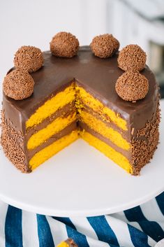 a chocolate and yellow cake on a white plate