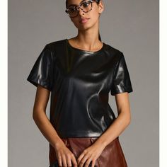 Porridge Collin Faux-Leather Short-Sleeve Top * Polyurethane, Polyester * Pullover Styling And Side-Zipper Closure * Hand Wash * Imported Dimensions Standard: * 25"L Plus: * 27"L Leather Blouse, Faux Leather Top, Leather Short, Black Vegan, Anthropologie Top, Leather Shorts, Black Top, Black Faux Leather, Short Sleeve Top