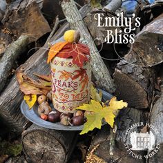 an image of a fall decoration on a plate with leaves and acorns around it