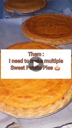 three pies on a table with a sign that says them i need to make multiple sweet potato pies