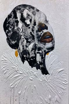 an abstract painting of a woman's face on a white wall with black and gold details