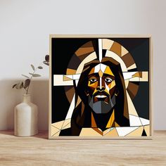 a wooden frame with a painting of jesus on it next to a potted plant