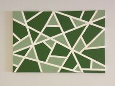 a green and white painting on the wall