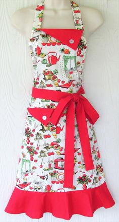 a woman's apron dress with red trimmings and an apron on the front