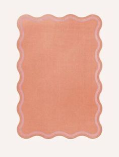 a pink square rug with scalloped edges on a white background in the shape of a rectangle