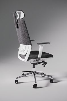 an office chair that is sitting on top of a metal base and black fabric upholstered seat