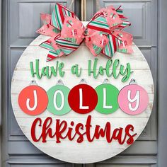 a christmas door hanger that says have a holly jolly christmas