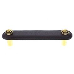 a black leather handle with two gold knobs