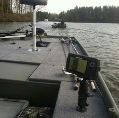 there are two boats that are on the water and one boat has a camera attached to it