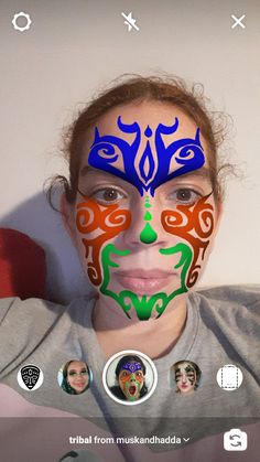 a woman with her face painted in different colors