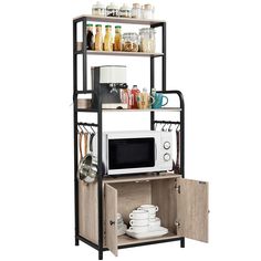 a microwave oven sitting on top of a wooden shelf filled with dishes and utensils