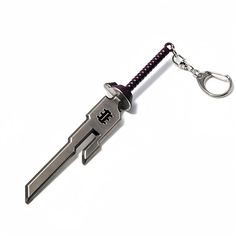 a knife shaped keychain with a black handle and purple cord attached to it