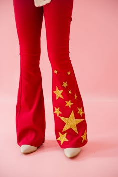 Embrace your American dream with these bold and playful red flares featuring gold stars at the flare. Show off your patriotism while staying stylish and unique. USA all the way! All orders are currently shipping within 14 business days. To receive item quicker, expedited shipping is available at checkout. Cool Red Outfits, Red Punk Outfits, Clown Core Fashion, Bold Colors Fashion, Star Clothes, Heart Clothing, Star Outfit, Red Stuff, Star Pants