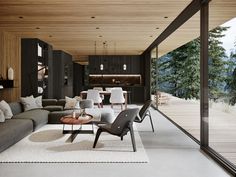 a living room filled with furniture next to a large window covered in wooden planks