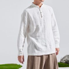 "Loose fitting. Stand collar. Long sleeves. Patial placket with Chinese hand knotted buttons. Our clothes are made to order. Process time is 2-3 weeks. Thanks for waiting and treasure our handmade clothing! Material Quality washed linen. Care Hand wash cold. Size & Fit Model: 188cm / 6'2\", 133LBS. His measurements are 35.5\"-31.5\"-38.5\" (90/80/98 cm) Wearing size: Size 2XL. Measurement Our clothes are made to order, non-returnable.  Measurements are as shown on last picture of the listing. If your size is larger than our 2XL, you may choose CUSTOM ORDER in size options and advise me your detailed measurements so that we can work out which size you are in and what the surcharge is. How to measure Follow the instructions below to easily measure yourself. We always recommend getting measur Formal White Linen Shirt, Luxury Linen Shirt For Semi-formal Occasions, Traditional White Linen Shirt, Classic Semi-formal Linen Shirt, Mandarin Collar Linen Shirt Men, Chinese Collar Shirt, Wool Maxi Coat, Chinese Shirt, Chinese Collar