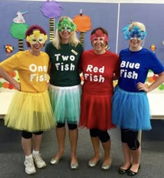 three girls in costumes standing next to each other