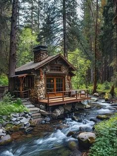 a small cabin in the woods next to a stream with rocks and trees around it