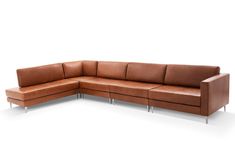 a brown leather sectional sofa with chrome legs and footrests on an isolated white background