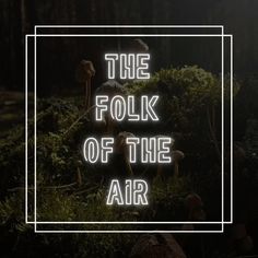 the folk of the air logo with mushrooms and grass in the foreground, against a dark background