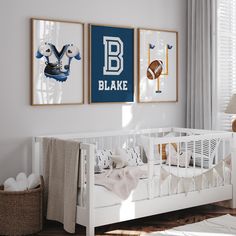 a baby's room with two pictures on the wall and a crib in the foreground