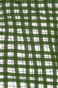 a green and white checkered fabric with lines in the center, as if it were woven