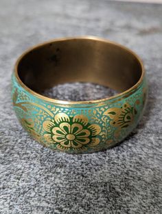 Vintage brass bangle bracelet floral turquoise green color. Gorgeous! Perfect edition to your boho bracelet stack. Green Bohemian Bracelets With Patina, Green Bohemian Bracelet Jewelry, Green Bohemian Style Bracelet, Bohemian Brass Bracelet With Patina, Bohemian Brass Bracelets For Festive Occasions, Handmade Green Bangle For Festivals, Handmade Green Bangle For Festival, Green Bohemian Bangle Jewelry, Bohemian Green Bangle Jewelry