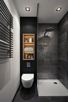 a bathroom with a toilet, sink and shower stall in black and white colors on the walls