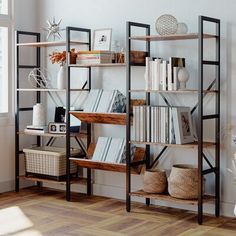 a bookshelf filled with lots of books in a living room next to a window