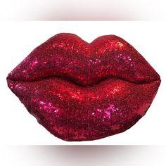 a red lipstick with pink glitter on it's lips and the bottom lip is slightly open