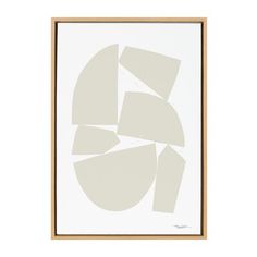 a white and brown framed art print with circles on the bottom, in a wooden frame