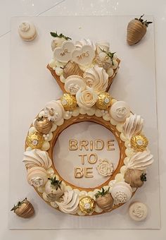 a bride to be sign made out of shells and flowers