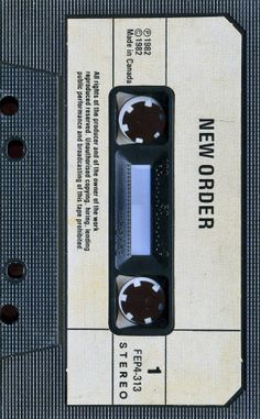 an old, black and white tape recorder with the words new order printed on it