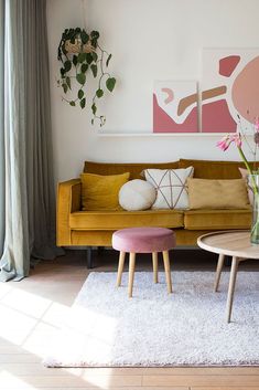 a living room filled with furniture and flowers