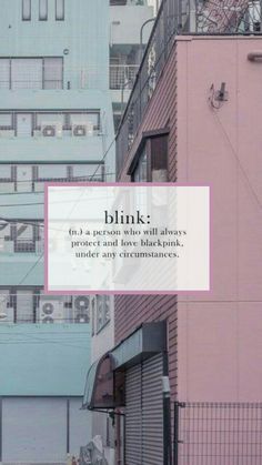 a pink building with the words blink on it in front of some other tall buildings