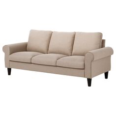 a beige couch sitting on top of a white floor