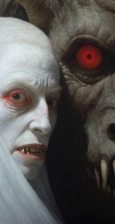 two demonic looking men with red eyes and white hair