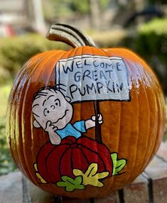 a pumpkin with a charlie brown sign painted on it