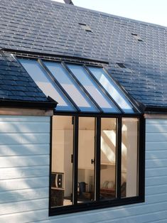 an image of a house that is being used as a solar powered extension to the roof