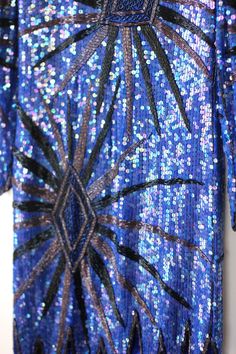 "Fun and funky Vintage Sequin Flapper inspired dress..timeless style for your one of a kind type of night.. This slips over the head. All the beads and sequins are in Very Good condition..i do not see any missing..although i might have missed something..this is all silk..beads and sequins. Lovely Zig zag hem. This is very small. It is a straight dress..so if you want it to fit loose, remember those measurements. Measuring: 36\" - 38\" long (zig zag hem) Sleeves: 22\" Width: Bust/hip/waist: 34\" Bohemian Flapper Dress With Sequins For Party, Gatsby Style Sequin Dress For Party Season, Gatsby Style Sequin Dress For Party, Bohemian Embellished Flapper Dress For Party, Blue Embellished Festival Dresses, Fitted Blue Flapper Dress For Summer, Fitted Blue Flapper Dress, Blue Sequin Dress With Contrast Detail, Blue Sequin Flapper Dress