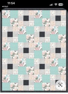 an iphone screen showing the quilt pattern in pastel blue, pink and grey colors