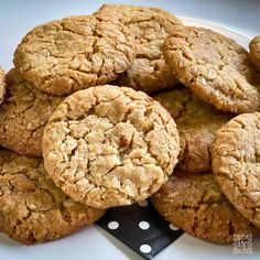 a white plate topped with cookies on top of a table