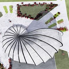 an aerial view of a large umbrella on the ground