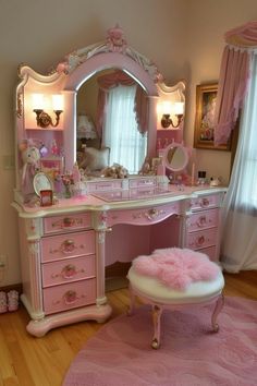 a pink vanity and stool in a room