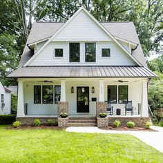 a white house with black doors and windows