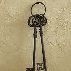 an old key hangs on the wall