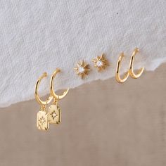 Shine Bright with our Celestial Earrings Gift Set! This handpicked collection features star studs, huggie earrings with charm, and small, simple huggies perfect for second piercings or cartilage accents. Whether you choose a set of two or three, our matching-gift-sets ensure a celestial sparkle that's as unique as you are! - Material: Hypoallergenic, Solid 925 sterling silver and 14 K gold filled finish  - Dimension:  21.5 mm x 5 mm / Huggie inner diameter: 9 mm - Turnaround time: Same day or Ne Double Piercings Ear, Gold Earrings Set Of 3, 2nd Hole Piercing Earrings, Cool Earrings Aesthetic, Hoop Stack, Cute Simple Earrings, Second Piercings, Celestial Earrings, Earrings Aesthetic